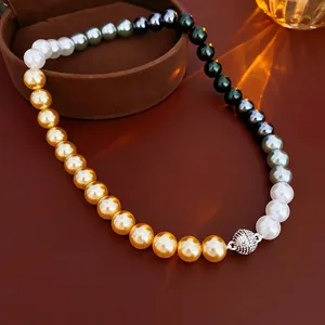 French vintage necklace with multi-colored pearls and a sparkling diamond-set sphere clasp