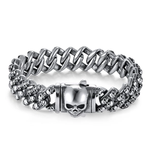 Retro stainless steel skull bracelet for men featuring a unique skeleton head clasp design