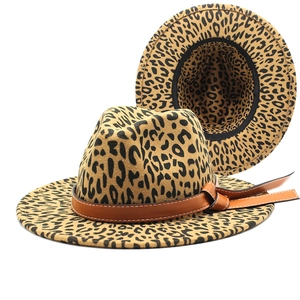 Detailed view of leopard print jazz hat with brown leather belt and bow decoration