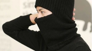 Detail of black winter knitted balaclava with fleece lining and windproof ear protection