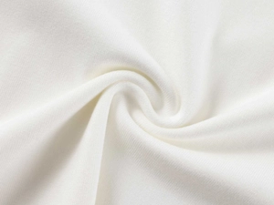 Close-up of white modal knit fabric texture with soft spiral folds and smooth finish