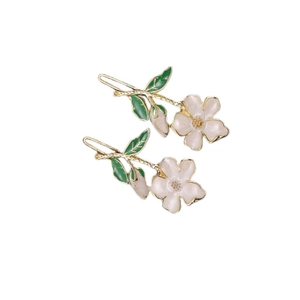 Elegant gold metal hair clips with light pink enamel flowers and green leaf details