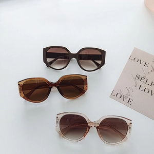 Three pairs of oversized fashion sunglasses in dark brown, amber, and champagne colors