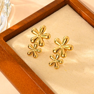 Polished 18k gold plated titanium steel double flower earrings in wooden display