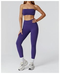 Detail of purple seamless yoga set showing high-waist leggings and sports bra texture