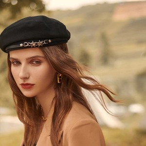 Retro black beret for women featuring star metal chain detail in high quality portrait