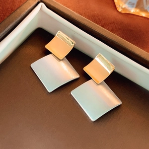 Minimalist square geometric stud earrings with brushed gold and silver metal finish
