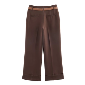 Deep brown high-waisted wide-leg trousers with leather belt and cuffed hem details