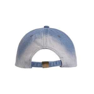 Detail view of adjustable brass buckle and distressed gradient denim on baseball cap