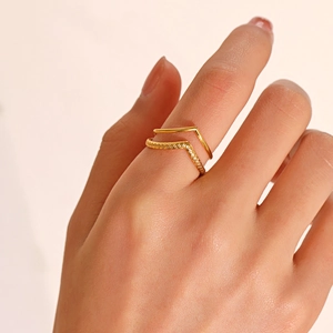 Minimalist double-layer golden V-shaped stainless steel ring worn by model