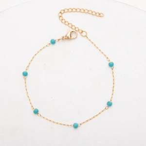 Bracelet en acier inoxydable plaqué or 18 carats avec perles turquoise et fermoir