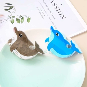 Cute dolphin hair clips in blue and marble brown, creative ocean themed shark claws