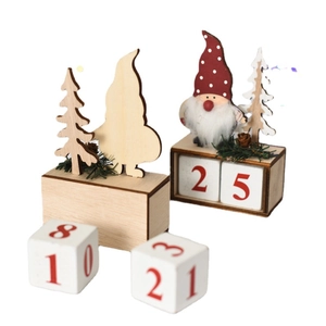 Wooden Christmas gnome countdown calendar with pine trees and numbered blocks on white background