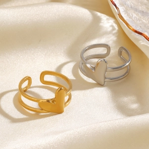 Minimalist gold and silver heart open rings set in stainless steel on silk fabric