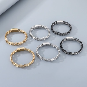 Detail view of double row industrial chains with magnetic clasps in gold silver and black