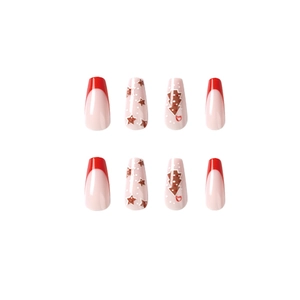 Festive red French tip press-on nails with Christmas tree and star patterns