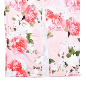 Detailed macro view of soft pink floral print fabric on a high-quality summer maxi dress