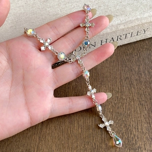 Elegant silver cross tassel Y-necklace with iridescent stones and a teardrop pendant drop