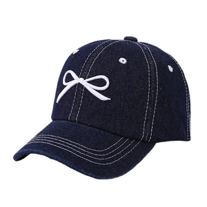 Dark blue denim baseball cap for kids featuring white bow embroidery and contrast stitching