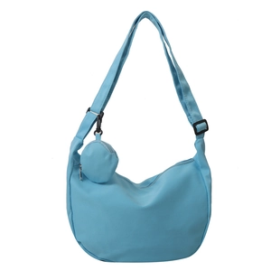 Minimalist light blue nylon half-moon crossbody bag with wide strap and mini coin purse