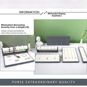 Modern grey and white jewelry display set for necklaces, rings, and bracelets