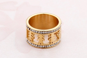Detailed close-up of golden stainless steel ring with zircon inlays and hollow figure