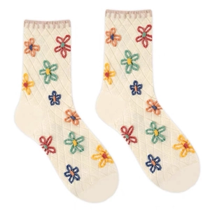 Cream knit mid-calf socks featuring colorful floral embroidery and argyle patterns