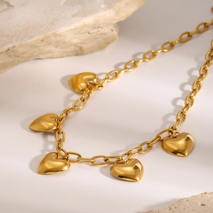 Vintage golden stainless steel necklace featuring five dangling 3D heart pendants