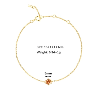 Detail of S925 sterling silver gold bracelet with a 5mm round orange zircon and adjustable buckle