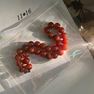 Close-up of translucent red agate beads 11x16mm size for jewelry organization