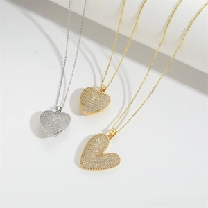 Elegant gold and silver heart pendants with sparkling zircons on fine metal chains