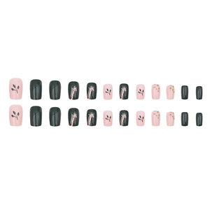 Dark green and pink press-on nails set with giraffe patterns and leaf motifs