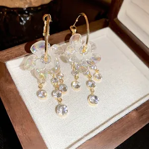 Elegant gold-plated floral earrings with crystal tassels in a premium jewelry gift box