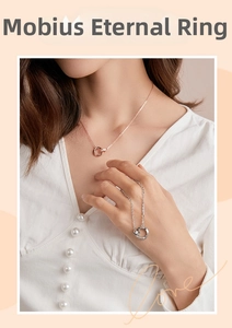 Detail view of interlocking Mobius rings necklace in rose gold and silver finish