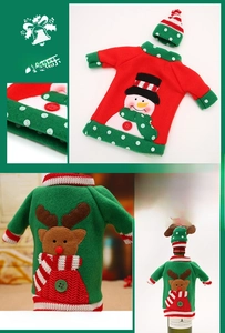 Detailed close-up of embroidered snowman and reindeer Christmas wine bottle covers