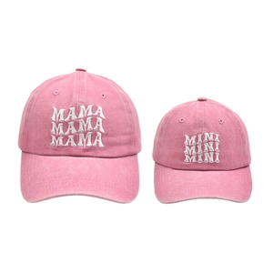 Detail of dusty pink washed cotton baseball caps with MAMA and MINI white embroidery