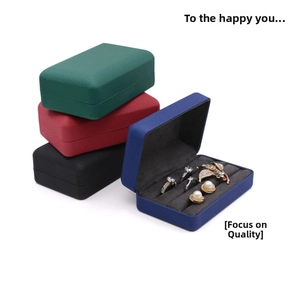 Macro shot of colorful velvet jewelry boxes showing multi-slot interior storage