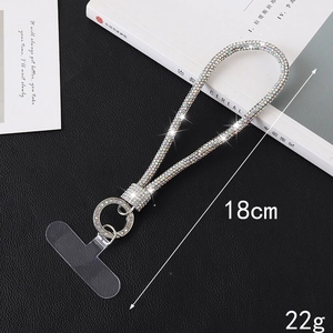 Luxury 18cm sparkling rhinestone phone lanyard with silver metal clasp on black desk