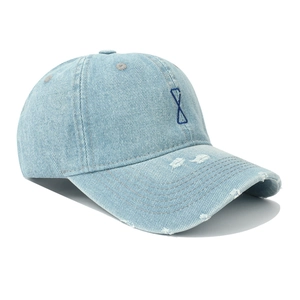 Distressed light blue denim baseball cap with embroidery and vintage ripped detailing
