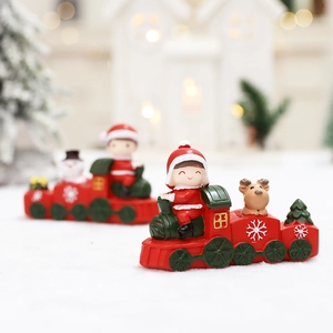 Christmas cartoon train miniatures with Santa and snowman on snowy background