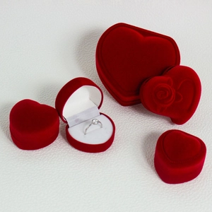 Romantic heart-shaped red velvet jewelry box set for rings and necklaces on white background