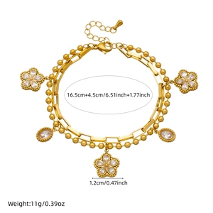 Double-layered gold-plated stainless steel bracelet with floral pendants and white crystals