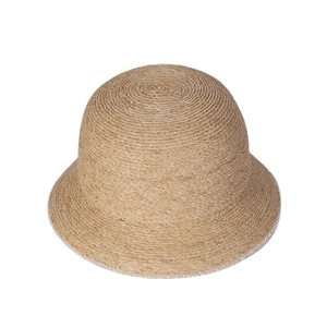 Elegant natural raffia cloche hat featuring a minimalist spiral weave and dome sun protection
