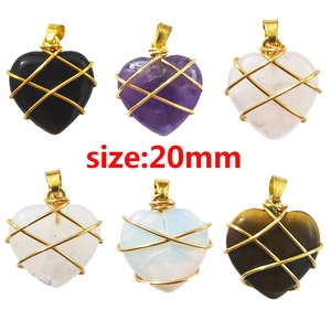 Natural crystal heart pendants wrapped in gold wire available in six different gemstone colors