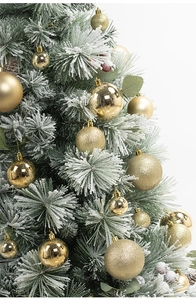 Detailed view of elegant gold Christmas tree ornaments with glitter and matte finishes