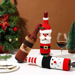 Knitted Christmas wine bottle covers featuring Santa, reindeer and snowman designs