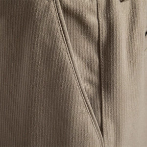 Men's khaki casual trousers featuring textured corduroy fabric and reinforced pocket stitching