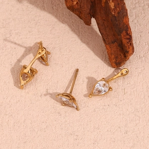 Set of 18K gold plated stainless steel teardrop zircon stud earrings on beige background