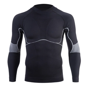 Detail of moisture-wicking compression top showing breathable mesh and seamless texture