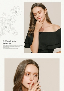 Detail of a ruffled off-shoulder black dress paired with a dainty minimalist silver ring